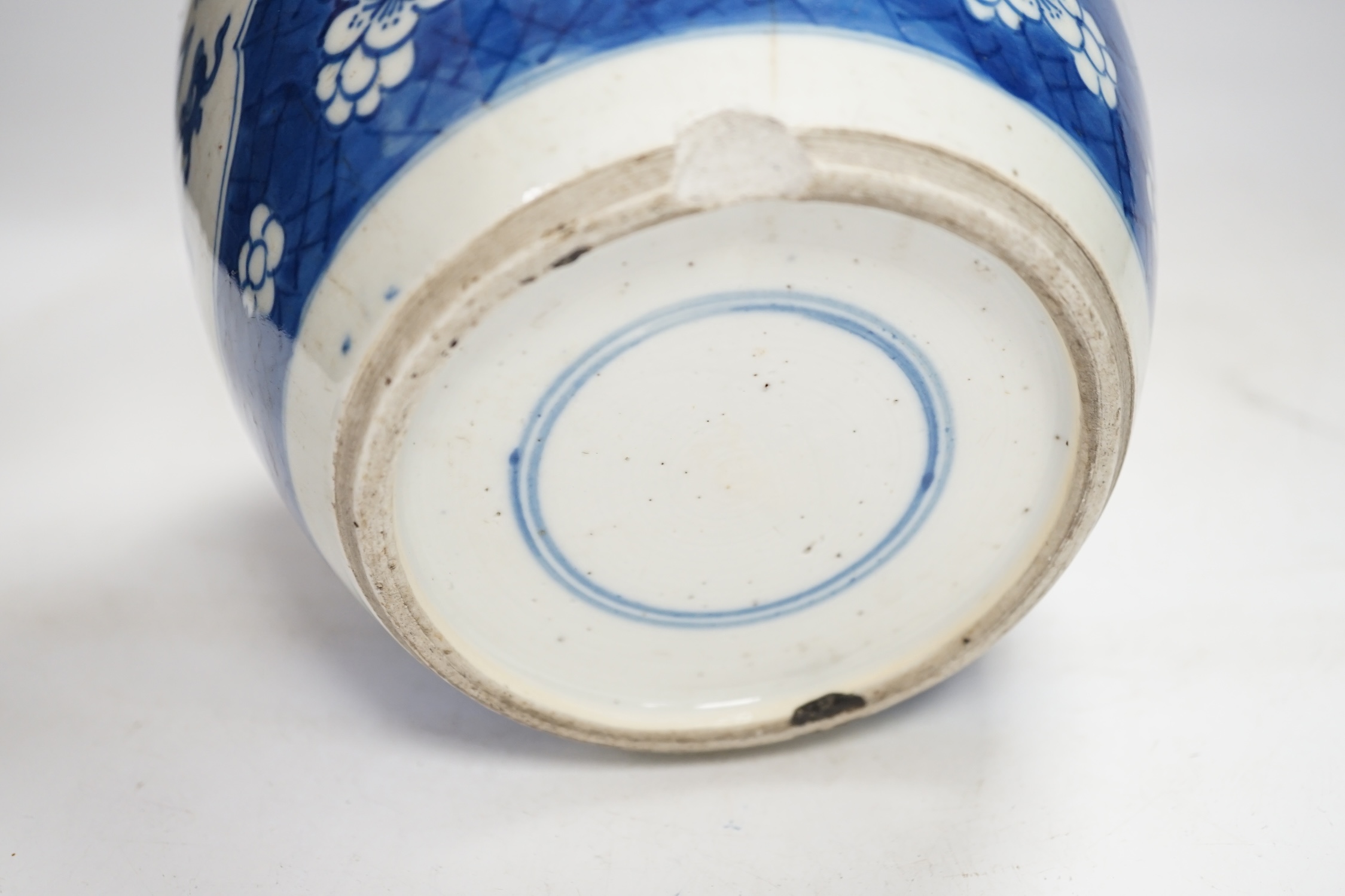 A Chinese Kangxi blue and white jar and a similar vase, jar 19.5cm high. Condition - both cracked and chipped, poor